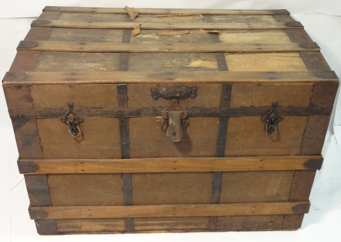 Antique Flat-Top Wooden Steamer Trunk: Antique flat-top wooden steamer trunk. 35" W x 21" D x 22 1/2" H, fair condition with some wear and discoloration.