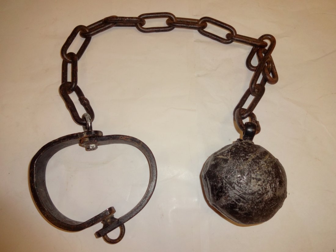 Antique Iron Ball and Chain: An antique iron ball and chain. 35" W x 5 1/4". Good used condition.
