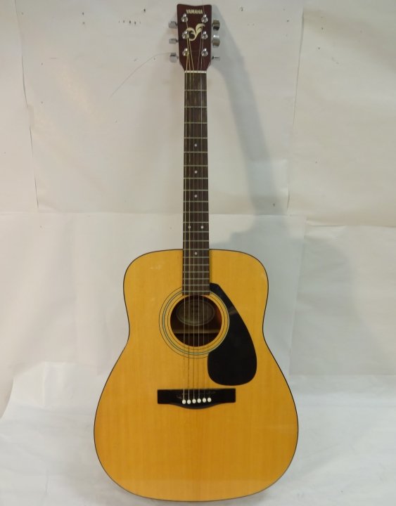 Yamaha Laminated Acoustic Guitar FG-40 w/Case: A Yamaha laminate wood guitar with case, Model No. FG-40. Has a hole in the side and a peg in the neck. Needs truss rod attention. Guitar only measures 40 1/2" W x 16 1/8" D x 4 5/8"H. Good condition 