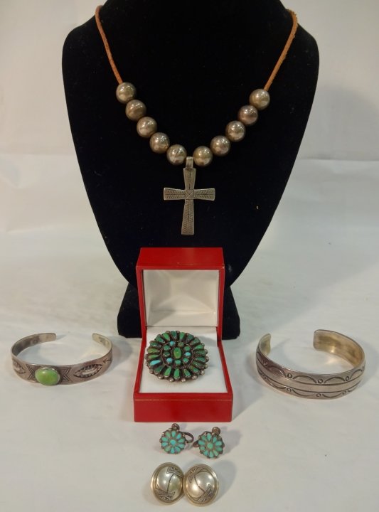 Lot of Native American and Mexican Jewelry: A lot of Native American pawn and turquoise with Mexican silver jewelry. Two pair earrings, two bracelets (one with turquoise) a crucifix and a turquoise sun burst ring. Necklace with crucifix measure