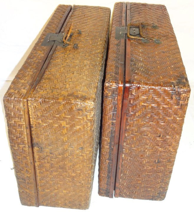 Pair of Wood Suitcases with Basket Weave Veneer: A pair of Chinese wood suitcases with basket weave veneer and metal closures. One measures 26" W x 15" D x 8 1/4" H, the other measures 24" W x 15 1/2" D x 7 1/2" H. Both in excellent condition.