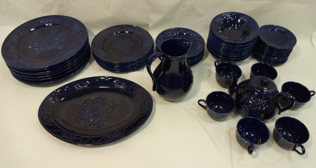 55-Piece Set of Blue Country French Dinnerware: A 55 piece set of Blue Country French-type dinnerware with serving pieces. One water pitcher, 7 1/2" x 6" x 9" H- One oval serving platter, 15 5/8" x 11 3/4" H- One tea pot, 9" x 6 1/2" x 6 1/2" H- Si