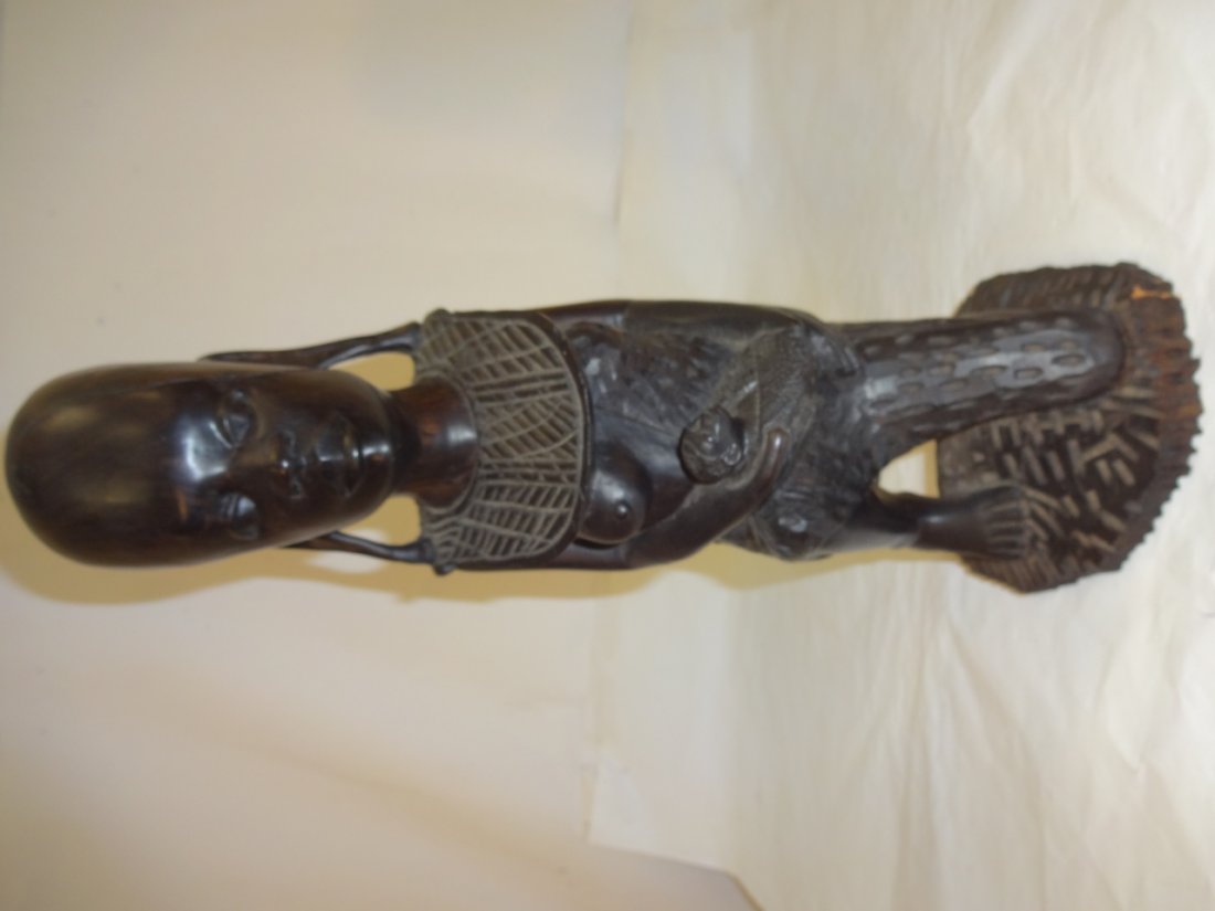 African Ebony Wood Carving of a Woman & Child: An African ebony wood carving of a woman and child, 4 3/4" W x 5 1/8" D x 13 7/8" H. Excellent condition.