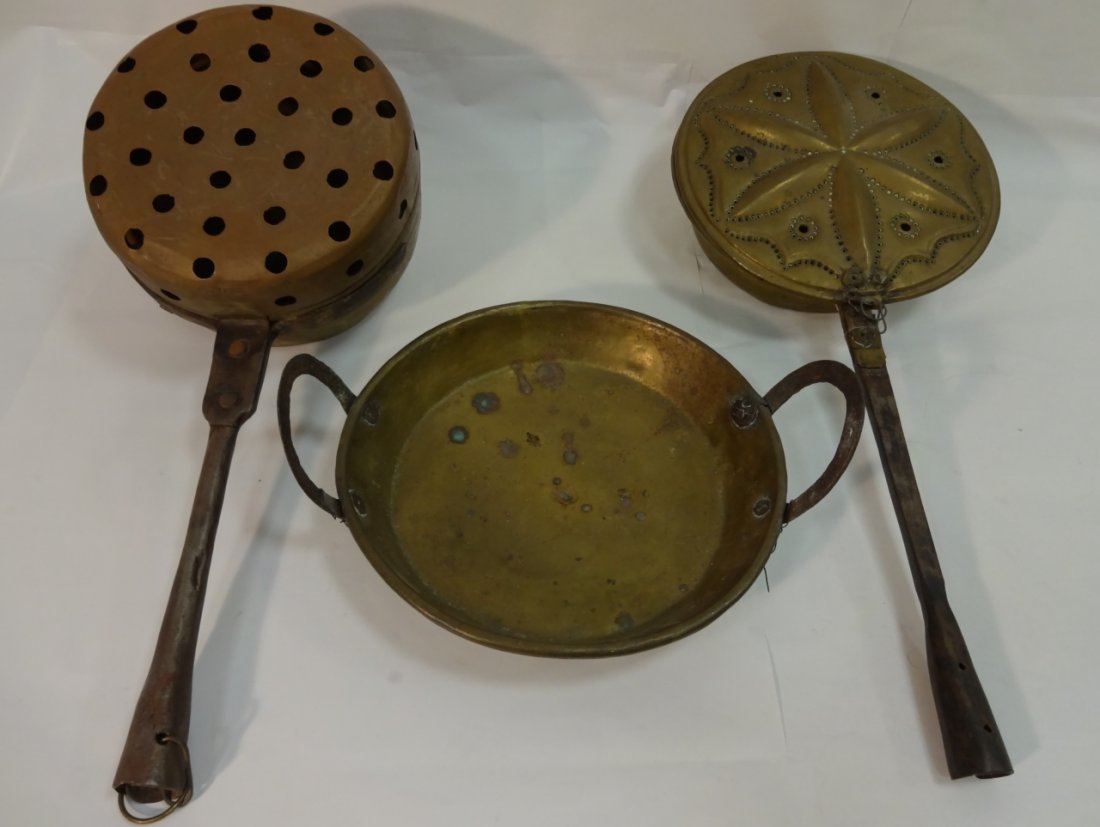Lot of 3 Early 18th Century Brass/Copper Pieces: A lot of early 18th c brass and copper pieces. Two bed warmers and one handled pot. Pot-type bed warmer, 8 1/2" dia. x 20" L - traditional bed warmer 10" dia. x 22" L- pan with handles, 10" dia. In fa