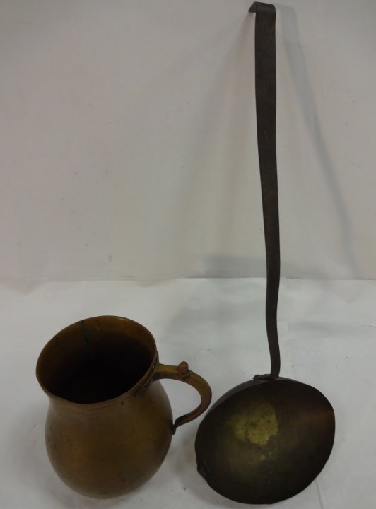 Lot of Antique Brass Pieces: A lot of two antique brass items. A Jacobean brass bed warmer with metal handle, 6 1/8" W x 19" L x 3" H. A brass tankard, 6 1/4" x 5" D x 6 7/8" H. Very good antique condition.
