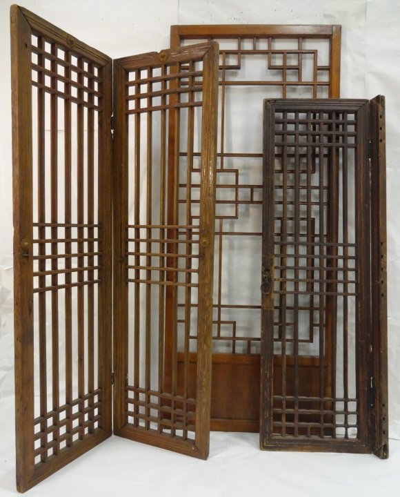 Lot of 3 Antique Korean Wood Interior Screens: A lot of three Korean antique sliding wooden interior screens from the early 20th century. Sliding panel measures 27 5/8" W x 66 1/2" H x 1 1/8" D. A two panel screen measures 16 1/4" W x 57 1/4" H x