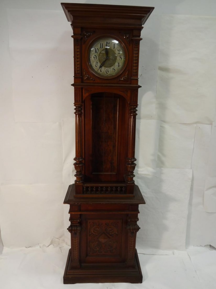 German Mahogany/Crotch Mahogany Grandfather Clock: A German mahogany and crotch mahogany grandfather clock, 25 3/4" W x 13 3/8" D x 81" H. Very good condition.