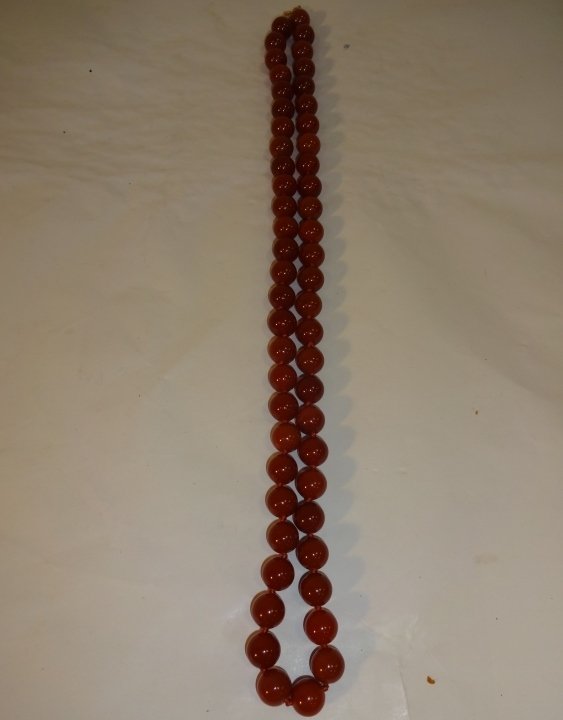 Vintage Carnelian Bead Necklace: A vintage red carnelian bead necklace. 29 3/4" L, excellent condition.