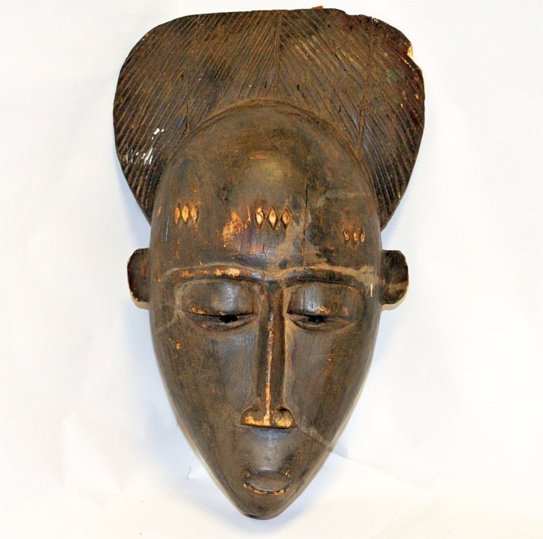 Antique African Tribal Mask: Antique African tribal mask, carved with inlaid semi-precious stone. Full size. 18" high by 10" wide by 6" deep. Very good condition.