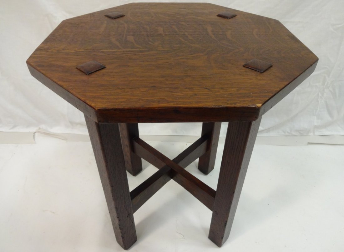 Am. Arts & Crafts Stickley Octagonal Table: FROM THE HOME OF RON HOWARD: American Arts & Crafts oak octagonal table by Gustav Stickley. The flat top over block legs joined by cruciform stretcher, bearing brand mark. 18" dia. by 20" H. Excellent
