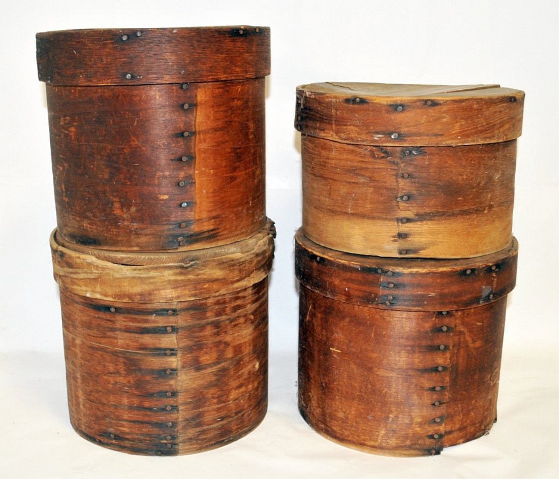 Four Antique Shaker Pantry Boxes with Lids: Grouping of four antique Shaker bent-wood covered boxes in similar sizes. All are missing all or most of the slats on the bases, but display well in spite of this. One has a loose slat on the lid port