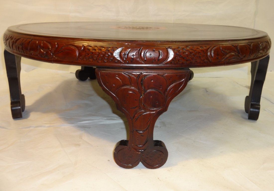 Decorative Carved & Hand-Painted Tea Table: A large carved wood tea table with center character and painted scenic medallion. 37" diameter x 12 1/2" H. Good condition with some water stains on table top.