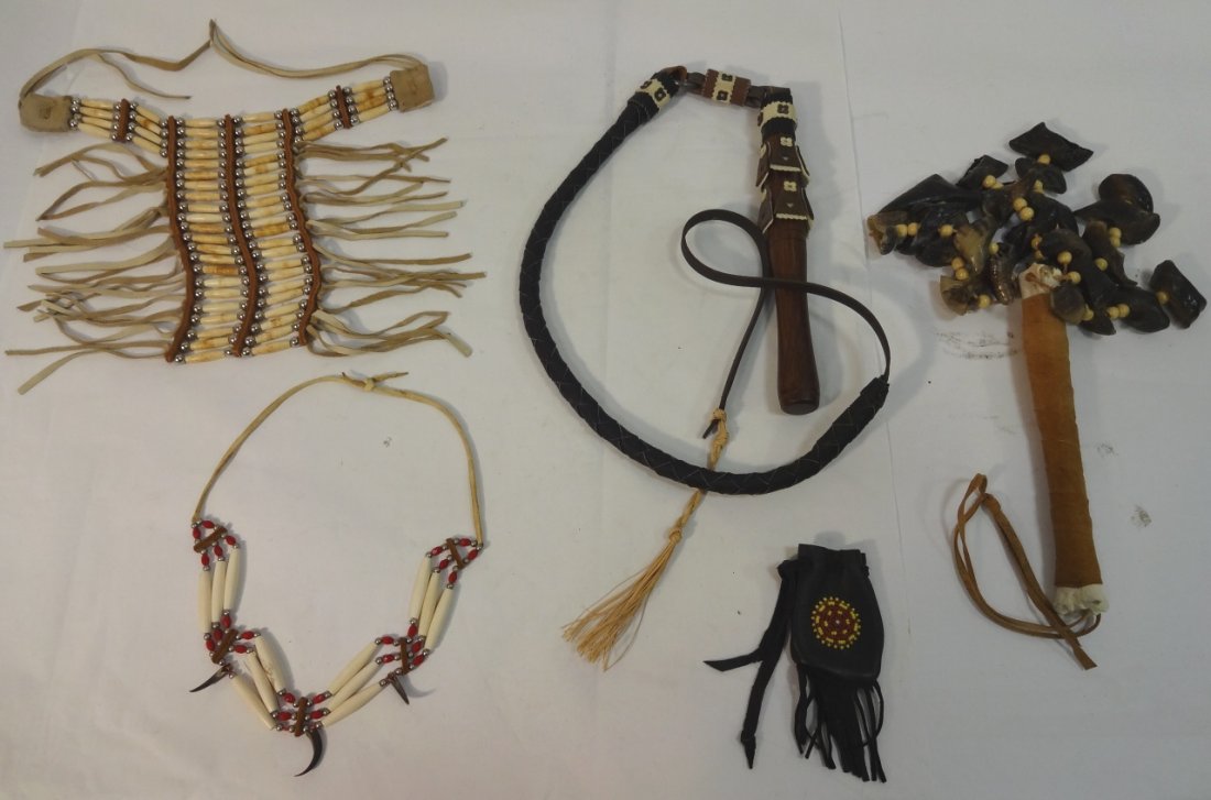 Lot of 5 Crafted Native American Items: Lot of 5 Native American crafted mid to late 20th century items. A bear claw rattle, 27" L - small leather pouch with fringe, 3 1/4" x 2 1/2" - beaded choker necklace 13" W x 8 3/8" H - a long beaded 