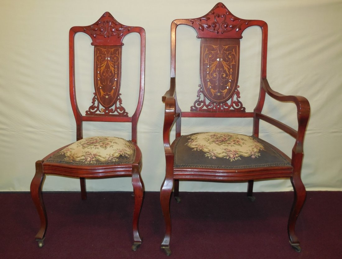 Carved w/Inlay Side & Arm Chair w/Needlepoint Seat: Two carved frame chairs with inlay and needlepoint covered seats. A side chair 18 1/2" W x 19 1/2" D x 38" H. An arm chair (with casters) 23 1/4" W x 23" D 40 H. Very good condition.