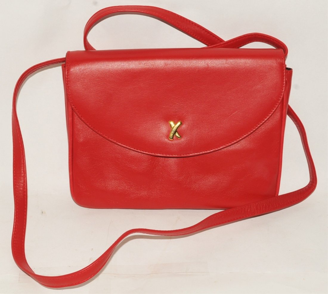 Paloma Picasso Red Leather Evening Bag: Paloma Picasso red leather evening bag with long shoulder strap measuring 8" wide by 6.5" high. VG cond.