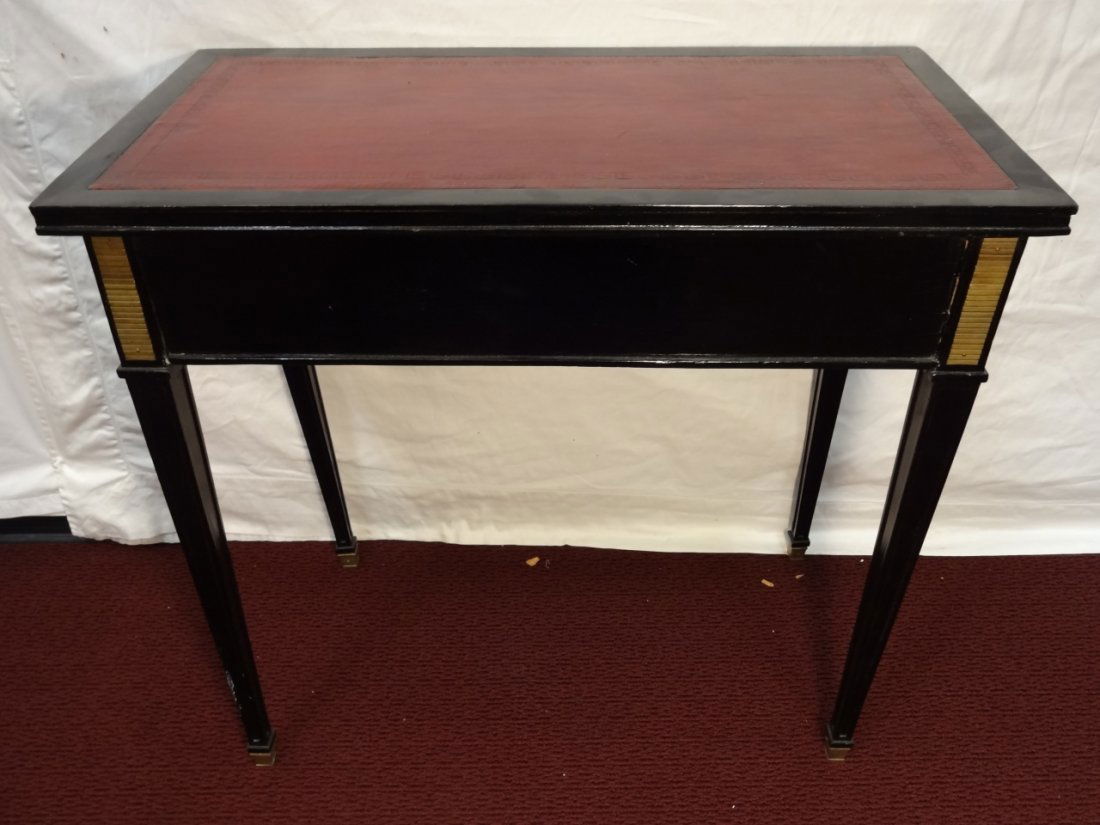 Jansen Signed Red Leather-Top Side Table: A Jansen signed red leather-top side table. Very good vintage to antique condition.