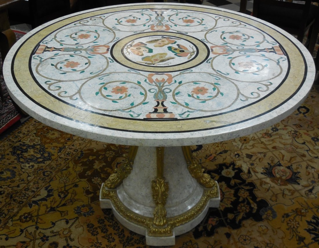 Faux Marble Inlay Top Single Pedestal Table: A faux marble inlay top single ormolu lion's head pedestal base. 44 1/4" Dia. x 32" H. Very good condition.