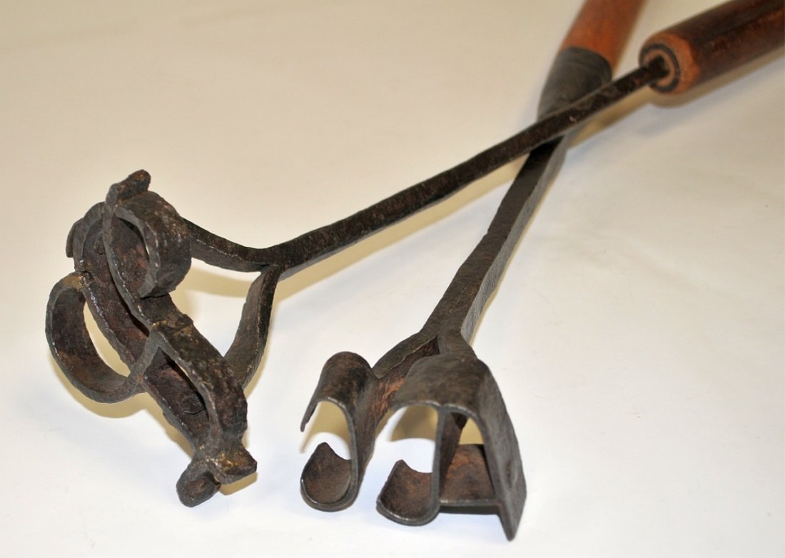 Pair of Antique Branding Irons with Wood Handles: Pair of antique branding irons with wooden handles. One marked "ACC", other is an indecipherable monogram. Each approximately 30" L, very good condition.