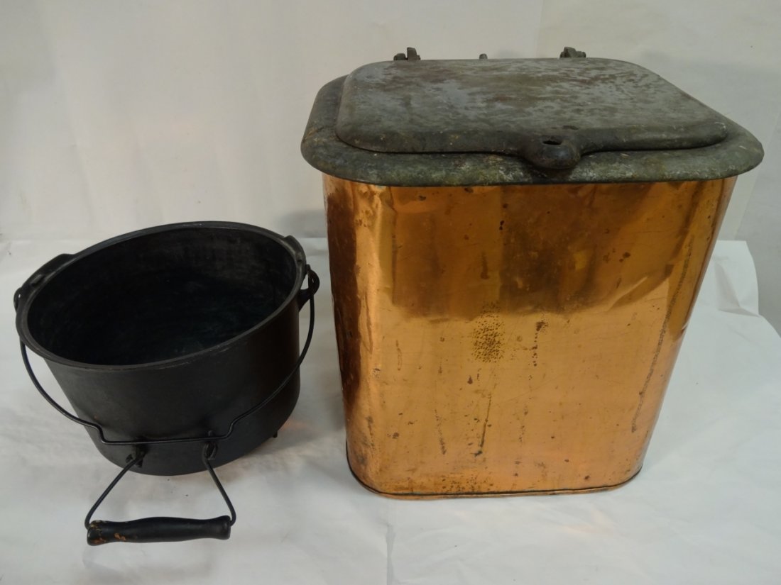 Lot of 2 Antique Copper and Iron Pieces: A lot of two antique copper and iron pieces. One copper coal container with iron lid, 14" W x 13 1/4" D x 14 5/8" H. An iron kettle with handles, 11 1/4" dia. x 8 3/8" H. Both in very good antique con
