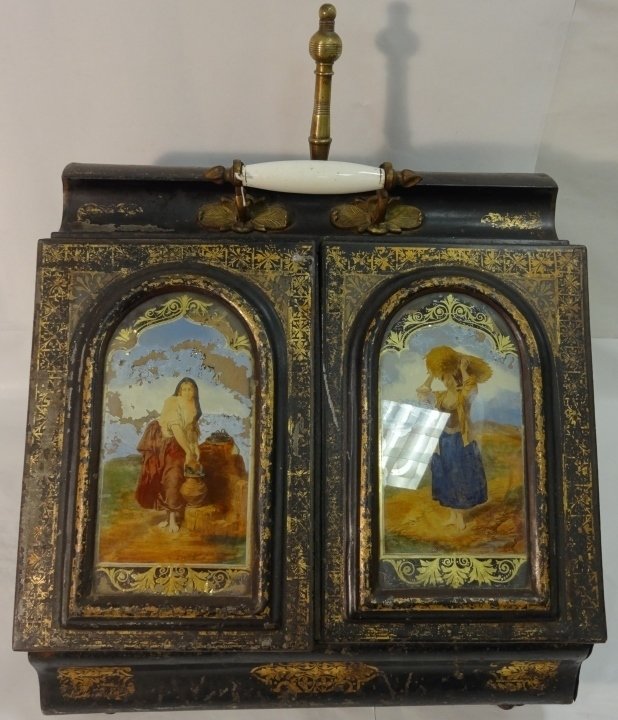 Victorian Tole Coal Scuttle with Eglomise Panels: A Victorian tole coal scuttle with two eglomise panels of harvest figures and brass-handled shovel. 18 1/8" W x 15 1/8" D x 19 1/2" H. Good condition with some erosion of the reverse glass painting.