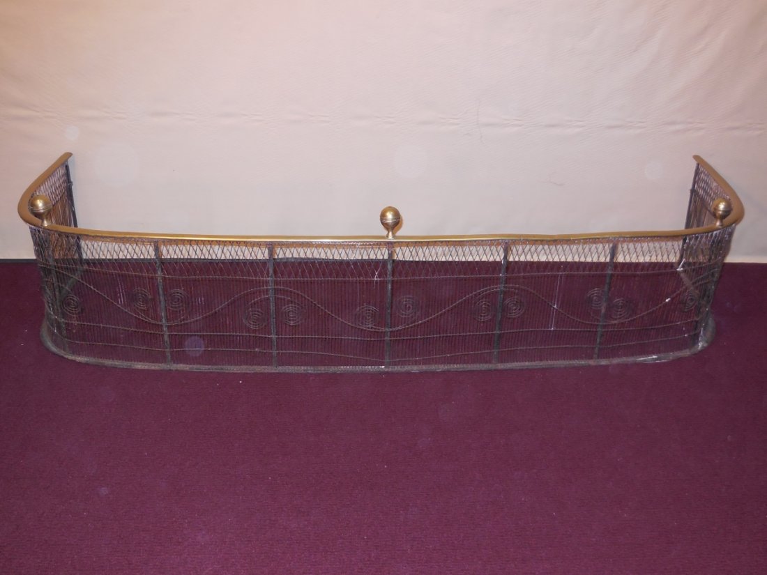 Brass & Twisted Wire Fireplace Fender: A brass and twisted wire fireplace fender. 58" W x 19 1/8" D x 13 5/8" H. Very good used condition.