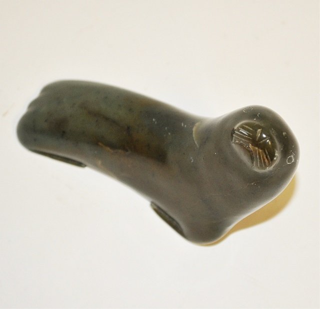 Inuit Signed Carved Hardstone Seal or Walrus: Vintage Inuit carved green hard-stone figure of either a seal or young walrus. Base retains an engraved signature in an Inuit alphabet, along with date and some sort of number. Very good condition. Me