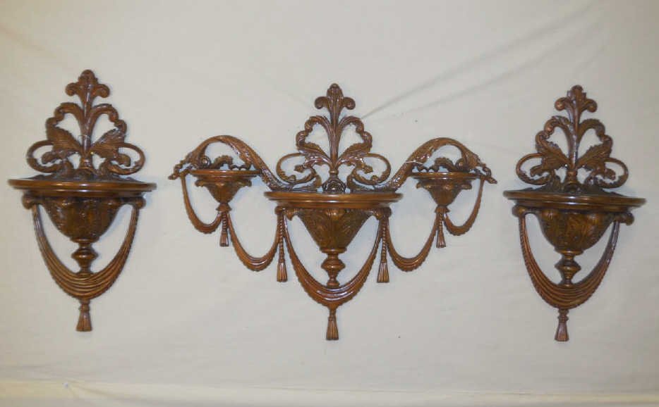 Set of 3 Cherry Wood Wall Shelf / Brackets Set of three: Set of three cherry wood wall brackets, adorned with ribbons and tassels, acanthus leave base. Two are 13 3/4" W x 8" D x 25 1/2".One is 32 /4" W x 8" D x 25 1/4" H. In excellent condition.