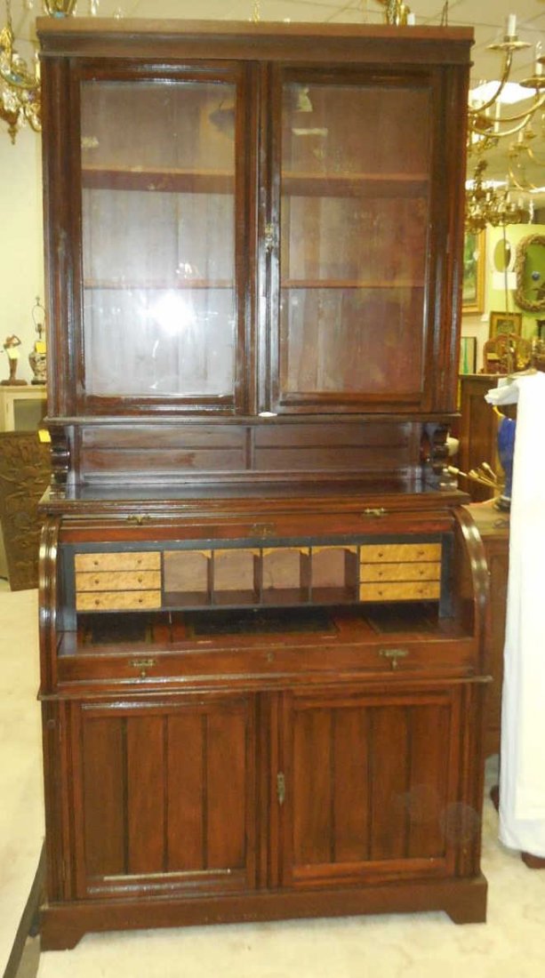 Roll Top Secretaire Desk w/ Top Hutch Roll top: Roll top secretary desk with top hutch. 6 drawers(one missing), 4 mail slots. Pull out desk surface has gold stamped leather, center surface of desk opens for storage. Top hutch has glass front doors