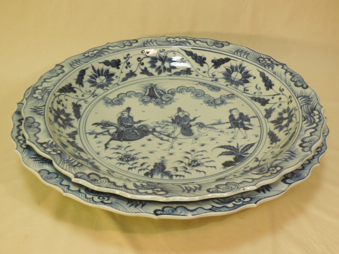Lot of 2 Blue & White Oversized Painted Platters: Lot of two blue and white oversized painted ironstone platters. 24" Diameter x 4 1/8" H, 23" diameter x 3 1/2" H. In very good condition.