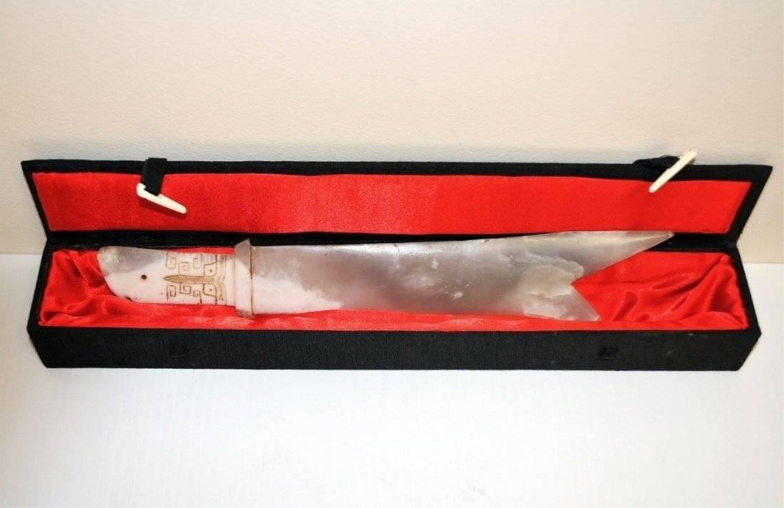 Zhou Dynasty White Jade Two-Pointed Dagger Ancient: Ancient Zhou Dynasty Chinese two-pointed white jade dagger with carved design handle and newer felt-lined box with ivory clasps. Dagger 12 1/2" W x 2" D, box 15 1/2" W x 2 1/2" D x 1 3/4" H, very good