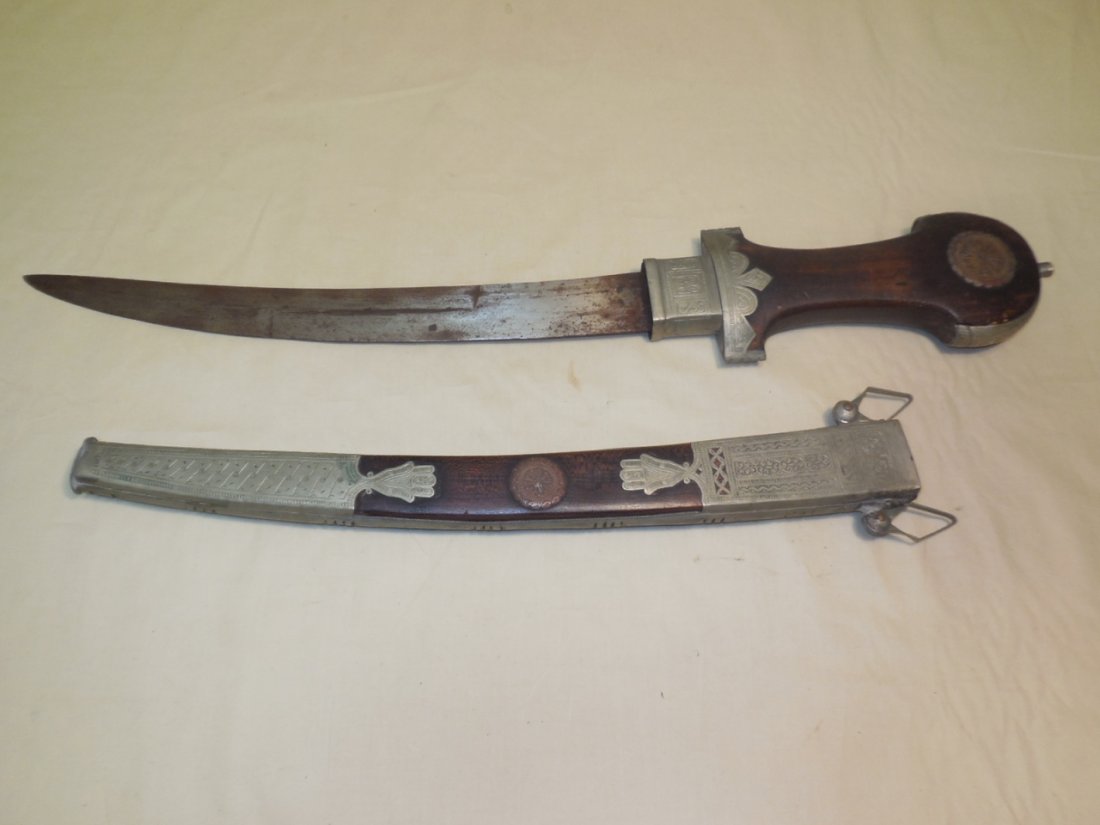 Vintage Arabian Knife Dagger With Sheath: Vintage Arabian knife dagger with sheath. Sheath is wood with applied etched metal detail. 24" long x 3 1/2" W. In very good original condition. Shipping available within the Continental USA (excludes