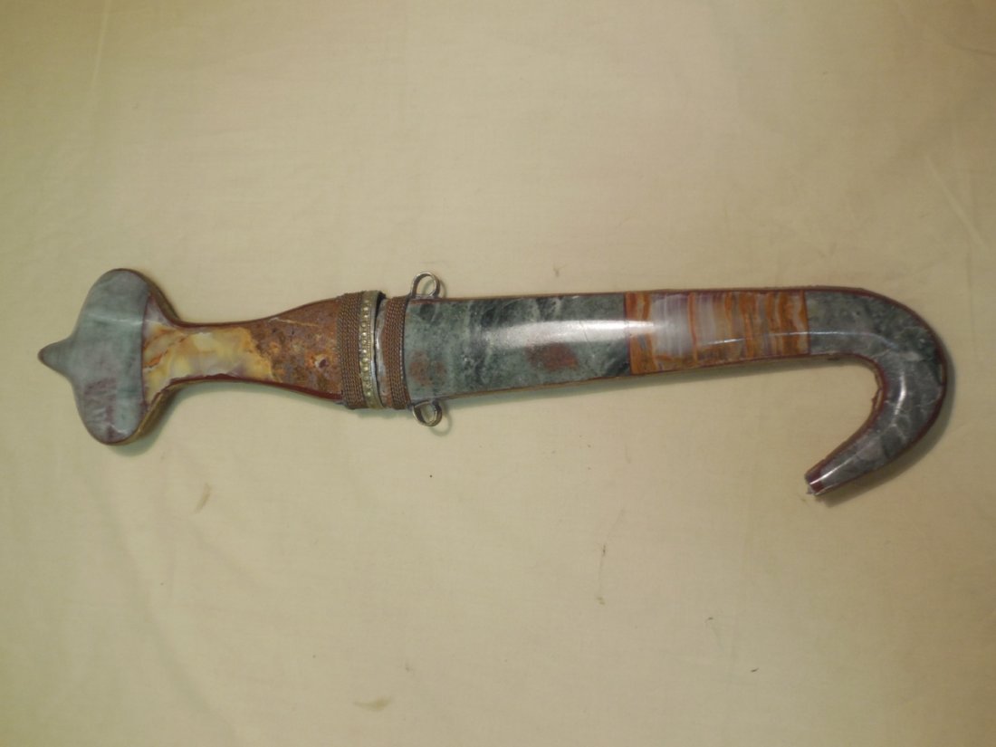 Vintage Arabian Knife Dagger With Sheath: Vintage Arabian knife dagger with sheath. Sheath is made of various applied stones. 15 3/4" x 3 1/2" W. In very good original condition. Shipping available within the Continental USA (excludes insuran