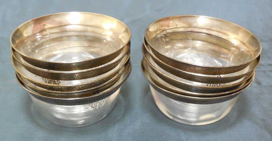 Antique Art Deco Sterling Silver Overlay Bowls: Antique Art Deco sterling silver overlay bowls. Clear glass with sterling band around top. Service of 10. Each measuring 2.5 inches in height and 4.75 inches in diameter.