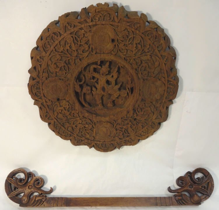 Lot of 2 Asian Carved Pieces: A lot of two Asian carved pieces. A carved circular wall plaque, 17 34" dia. A small carved window cornice, 26 5/8" W x 4 5/8" H x 7/8" D. The circular piece has a repair but otherwise both pieces in 