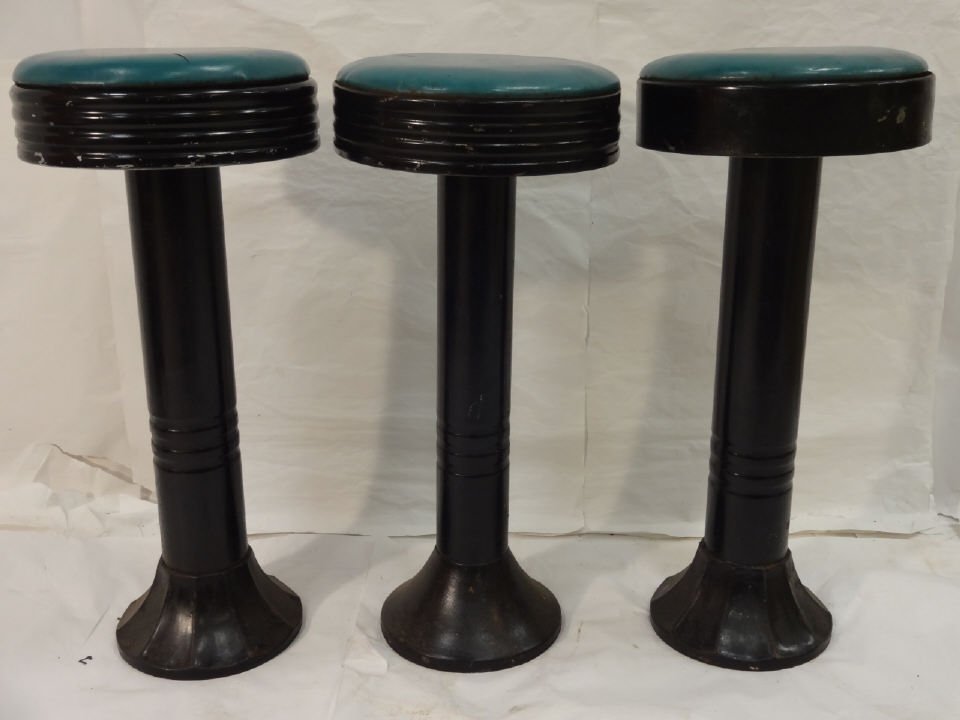 Lot of 3 Vintage Metal Base Diner Swivel Stools: A lot of three vintage metal base diner swivel stools upholstered in green vinyl. 12 1/2" dia. x 27 1/2" H. Excellent vintage condition.