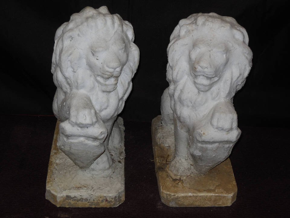 Pair Vintage Cement Lion Garden Statues: A pair of plaster covered cement lion garden or entryway statues. 9" W x 16" D x 20" H. Good outdoor condition with some chipping of plaster.