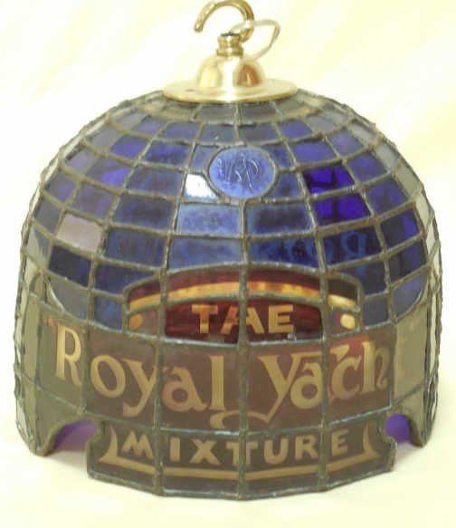 Vintage Dunhill Royal Yacht Mixture Light Fixture: Vintage Dunhill "Royal Yacht Mixture" hanging light fixture, stained glass. Has the Dunhill logo on glass. 10" h x 9" dia. Needs to be rewired.
