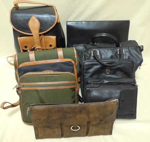 Assorted Dunhill Travel Accessories Leather: This lot includes a back pack, purse, canvas and leather toiletry bags and two clutches - most marked Dunhill. The largest piece measures 16" H. All in like new to very good condition.