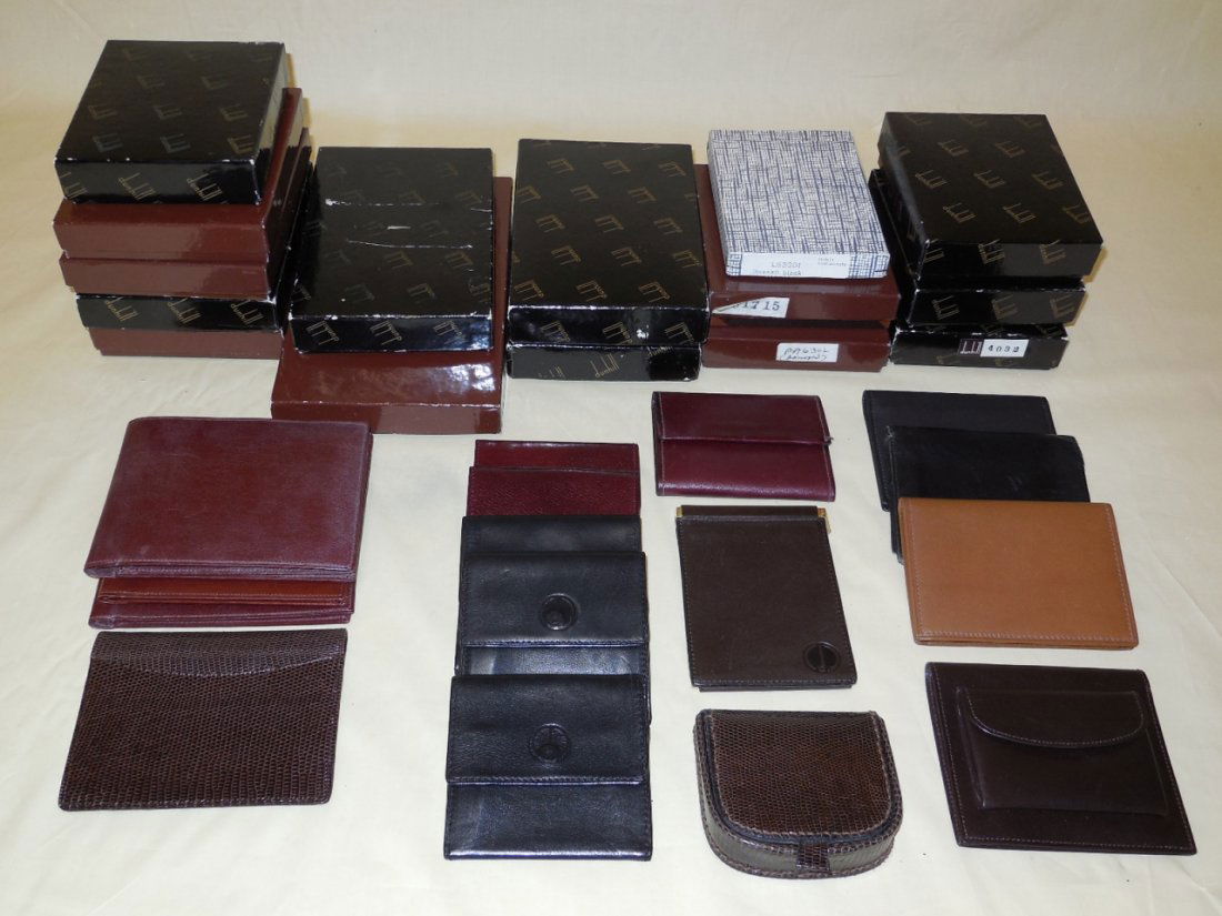 Assorted Vintage Dunhill Leather Accessories: Assorted vintage Dunhill leather accessories. Including change purses, card holders, key cases. Many marked Dunhill in original boxes. Largest measure 4" x 4 1/2". In like new / unused