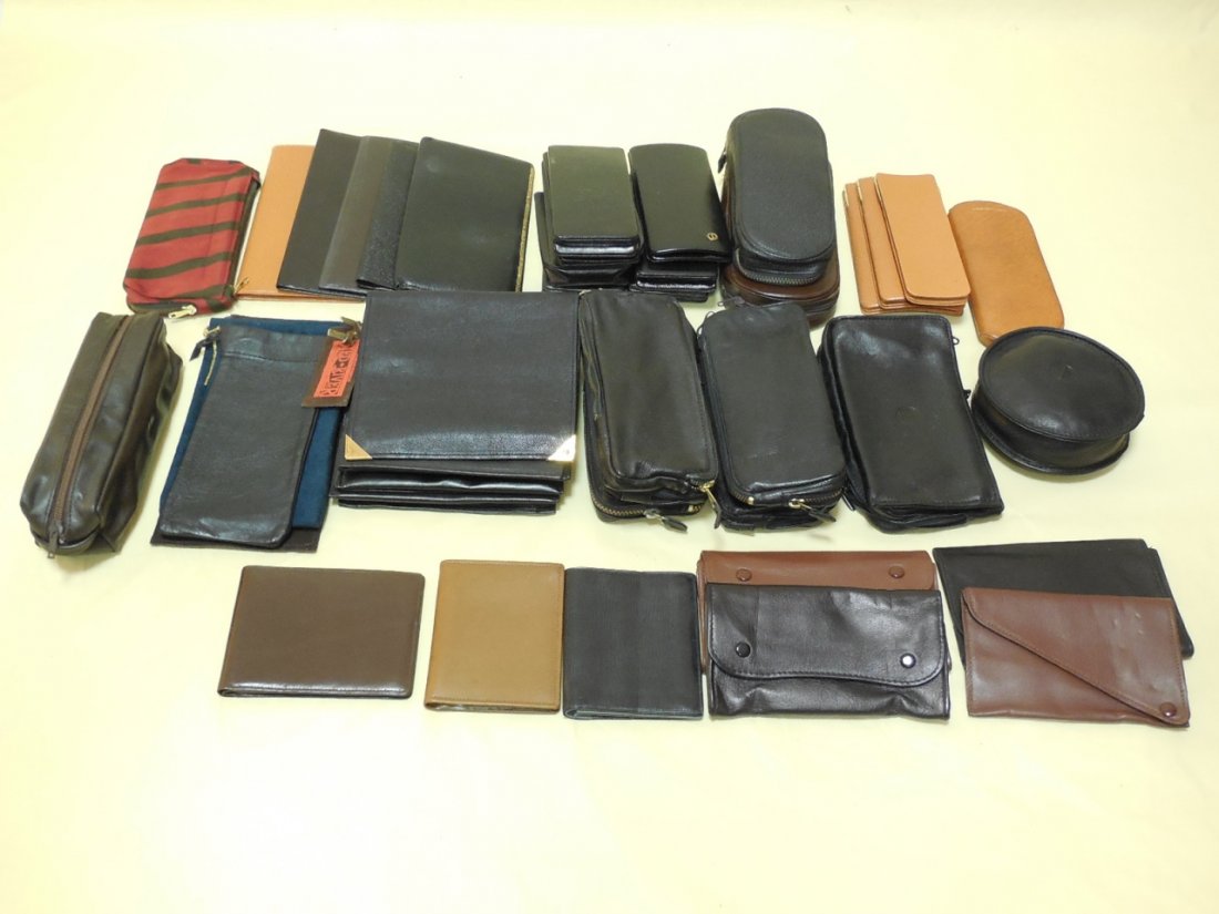 Assorted Vintage Dunhill Leather Accessories: Assorted vintage Dunhill leather accessories. Including glasses cases, leather pouches, check book holders and wallets / coin purses. Largest measure: 6" x 6". In like new / unused condition.