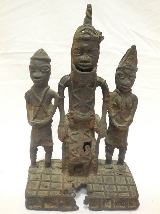 Nigerian Benin Bronze Sculpture of 3 Figures: Antique Benin style bronze sculpture of three figures. Possibly an Oba on a throne with two attendants. 7" W x 4" W x 11" H. In good original antique condition. Shipping available within the
