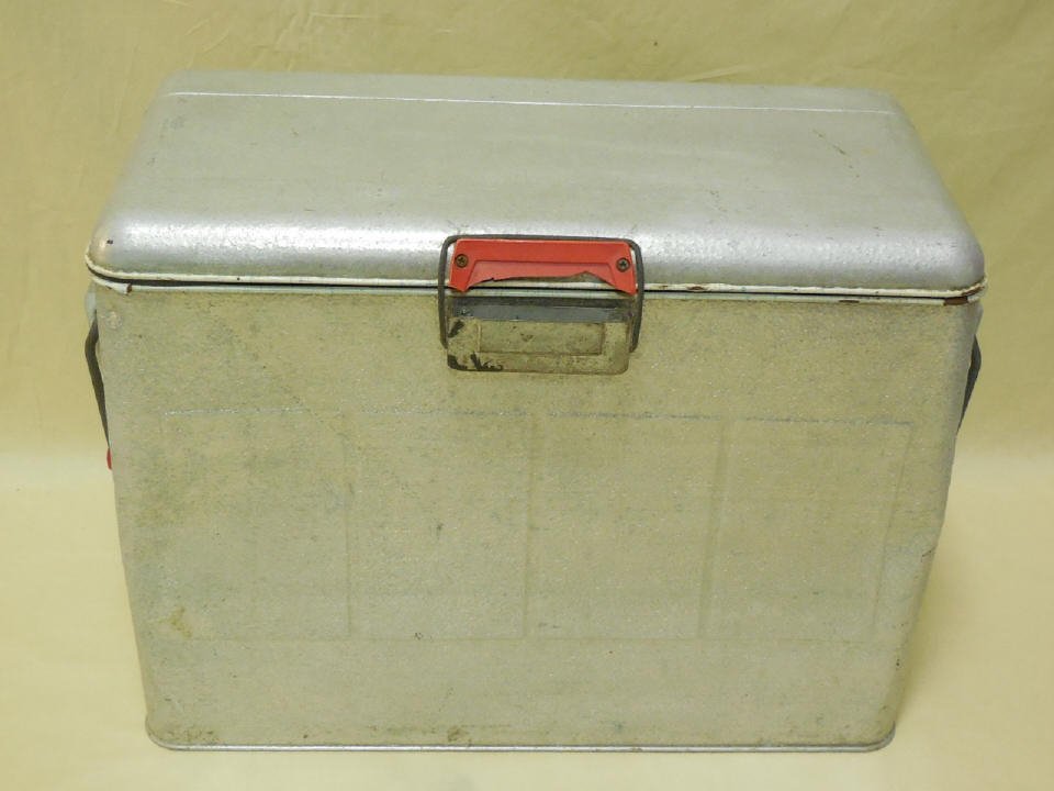 Large Vintage American Retro Style Cooler: Large vintage American, Retro style cooler in chrome tone with handles. Great decorator item. Measures 15 inches in height, 19 inches in width, 10 in depth.