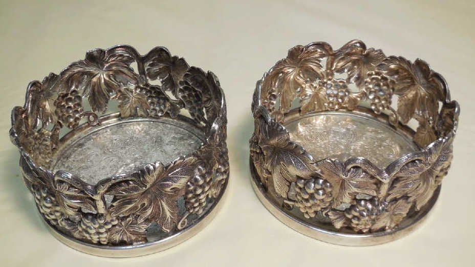 Pair Portuguese Topazio Silver Plate Wine Coasters: A pair of Portuguese Topazio silver plate wine coaster with grape design. 4" Dia. x 2 1/4" H. Very good condition.