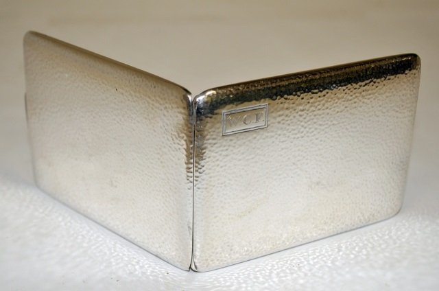 Art Deco Hammered Sterling Cigarette Case: Art Deco hammered sterling cigarette case with gold gilting. Marked sterling, 1922 inscription from previous owner. 4" H x 3" W, 70 grams, very good antique condition.