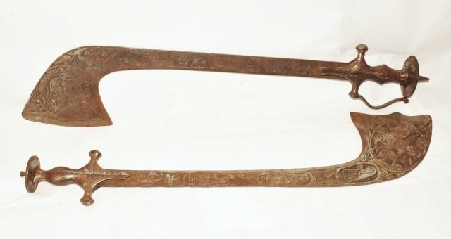 Pair Antique Indian Mughal Scimtars w Animals: Antique pair of Indian shamshir shekargar Mughal scimitars with engraved animals and people all over the blades. The blades end in a wider part. Sword #1 measures 27" long diagonally by about 5½" wid