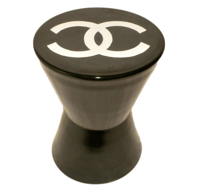 Vintage CHANEL Product Display Stool: Brown glazed pottery product display stool with Chanel logo on the top. Measures 16.5" high by 12" wide. Very good condition.