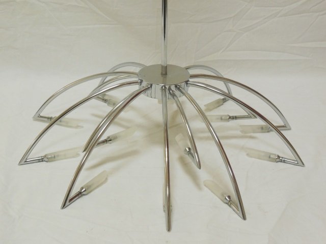 Mid Century Modern Chrome Light Fixture Chandelier: Mid-century chrome ceiling light fixture. 15 arms with frosted glass shades. 23"diameter x 44" H. In good vintage condition.