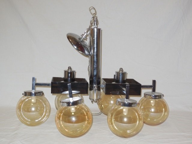Mid Century Modern Chrome Light Fixture Chandelier: Mid-century chrome and black lucite ceiling light fixture. Six amber colored globe shades. Chain can be adjusted or replaced. 26" W x 18" D x 26" H. In good vintage condition.