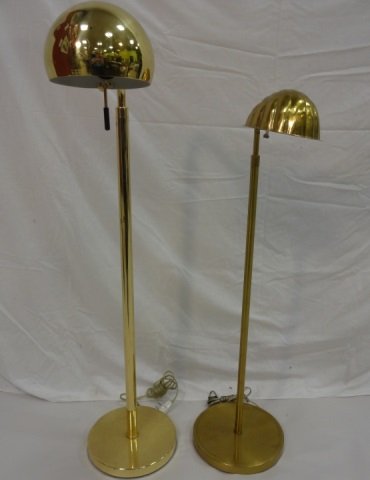 Mid Century & Vintage Brass Finish Floor Lamps: A pair of adjustable height brass floor lamps. A half sphere shade with dimmer, 201/4" dia. x 41-55 3/4" H and a sea shell shade, 16" dia. x 34 1/4"-43" H. Both in good condition.