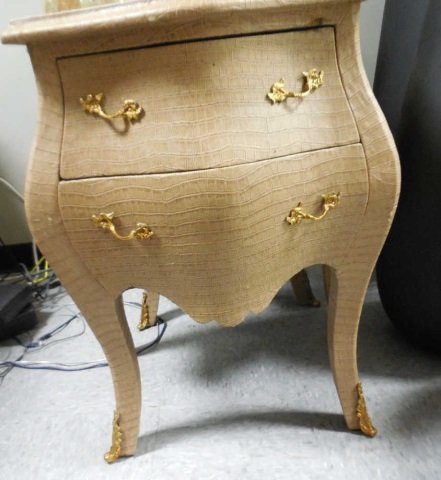 Pair Faux Beige Alligator 2 Drawer Bombay Chests: A pair of faux beige alligator skin covered two drawer bombay chests / side tables with brass pull and leg detail. 25" W x 16 1/2" D x 30" H. Good condition.